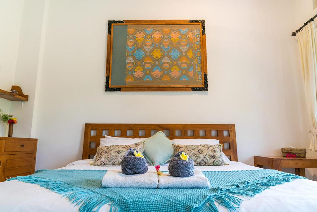 Postel nebo postele na pokoji v ubytování Buddha Homestay