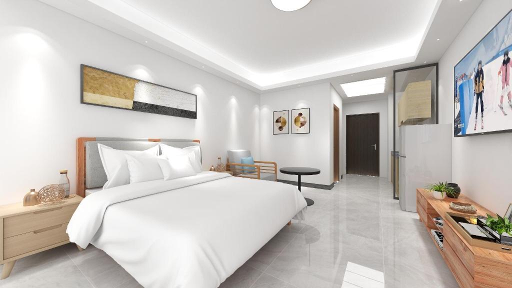 Postel nebo postele na pokoji v ubytování Foshan Laide Apartment