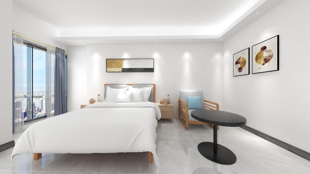 Postel nebo postele na pokoji v ubytování Foshan Laide Apartment