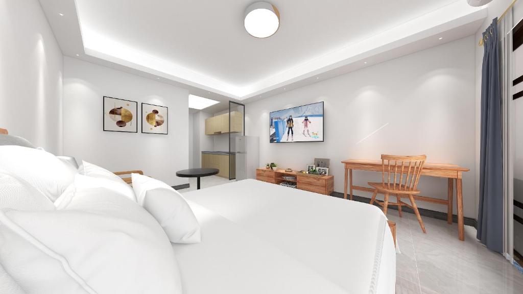 Postel nebo postele na pokoji v ubytování Foshan Laide Apartment