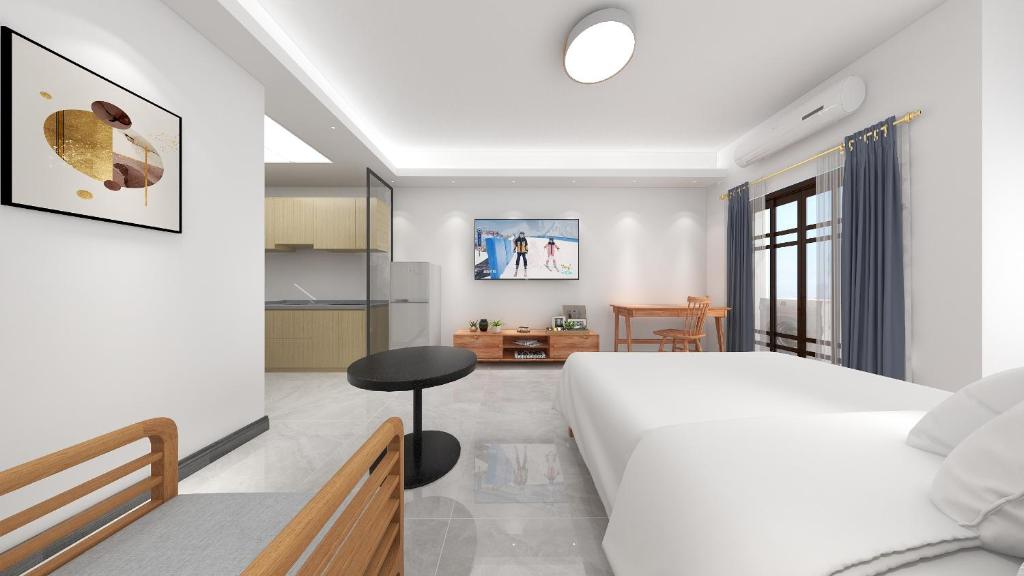 Postel nebo postele na pokoji v ubytování Foshan Laide Apartment