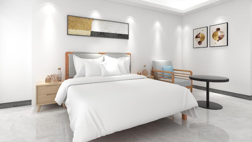 Postel nebo postele na pokoji v ubytování Foshan Laide Apartment