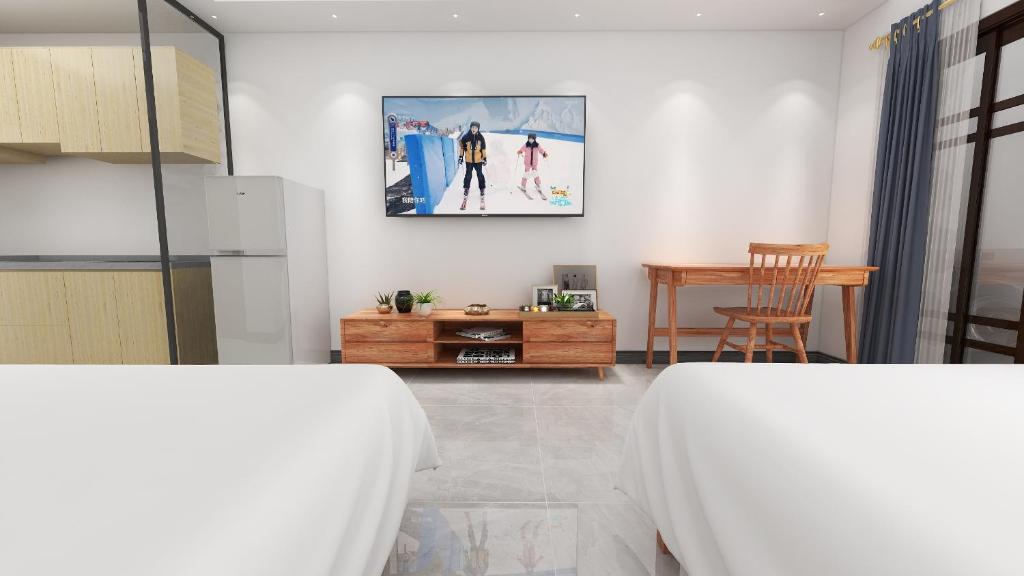 Postel nebo postele na pokoji v ubytování Foshan Laide Apartment