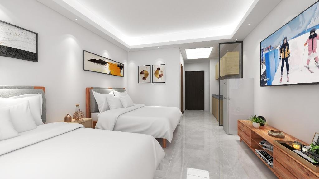 Postel nebo postele na pokoji v ubytování Foshan Laide Apartment