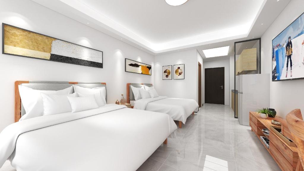 Postel nebo postele na pokoji v ubytování Foshan Laide Apartment