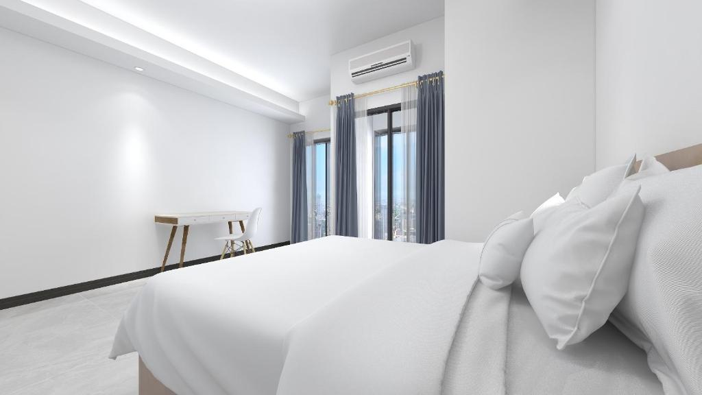 Postel nebo postele na pokoji v ubytování Foshan Laide Apartment