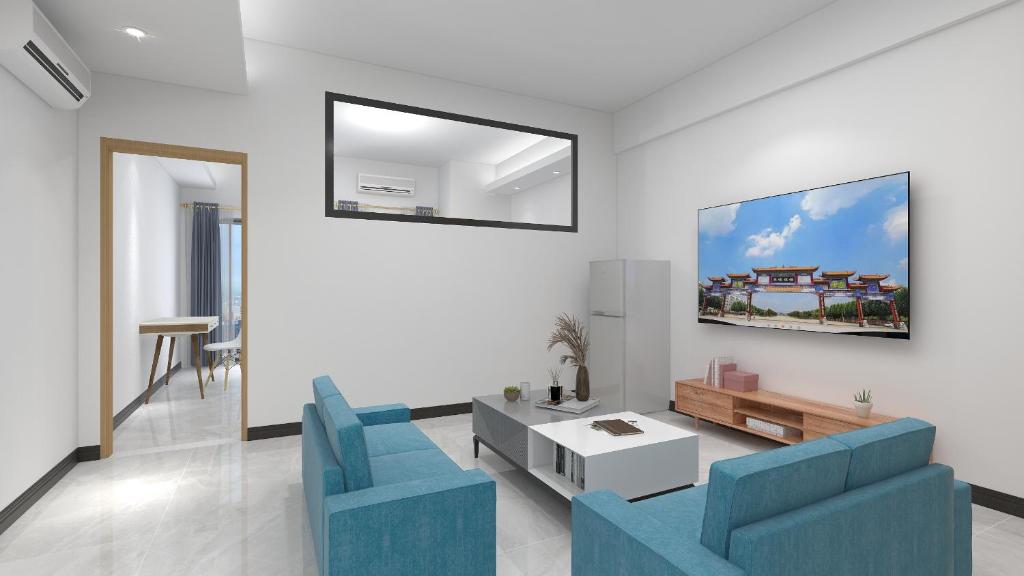 TV a/nebo společenská místnost v ubytování Foshan Laide Apartment