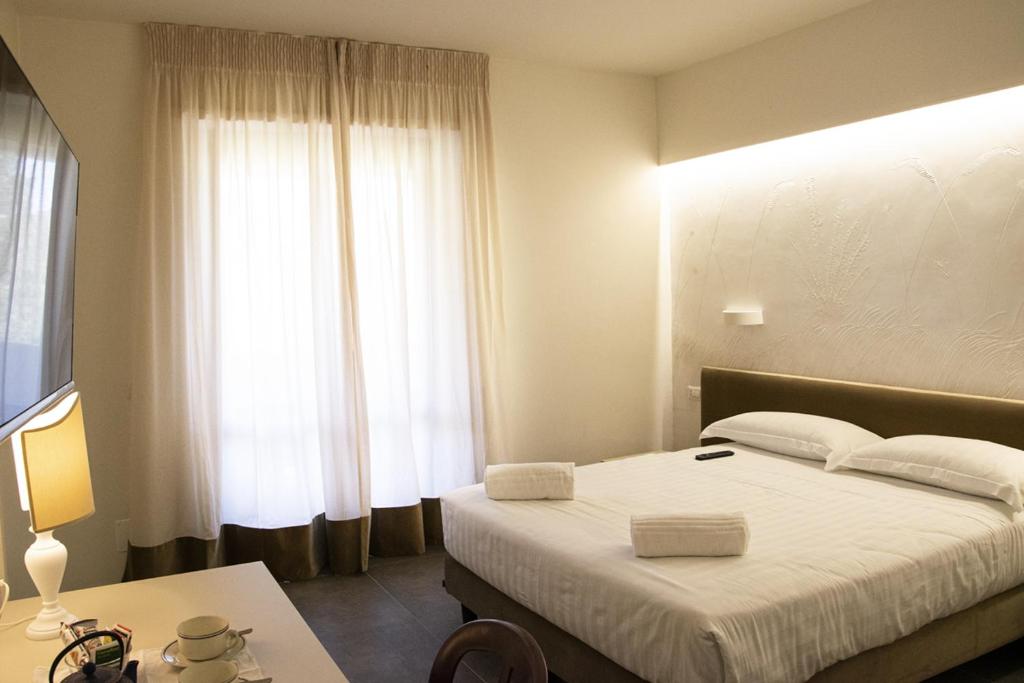 Postel nebo postele na pokoji v ubytování Hotel Terme Sant'Egidio