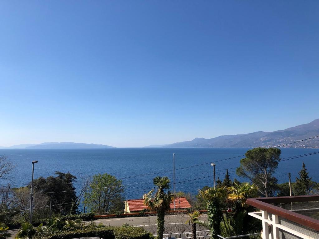a view of the ocean from a house at Apartment Bella Costa in Rijeka