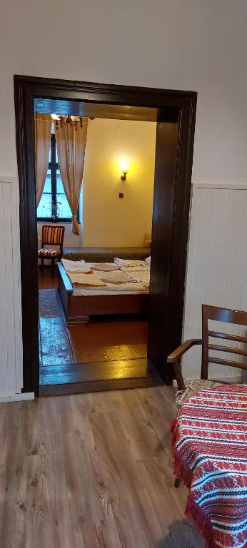 Postel nebo postele na pokoji v ubytování Kázmér Szállás - Gasthaus