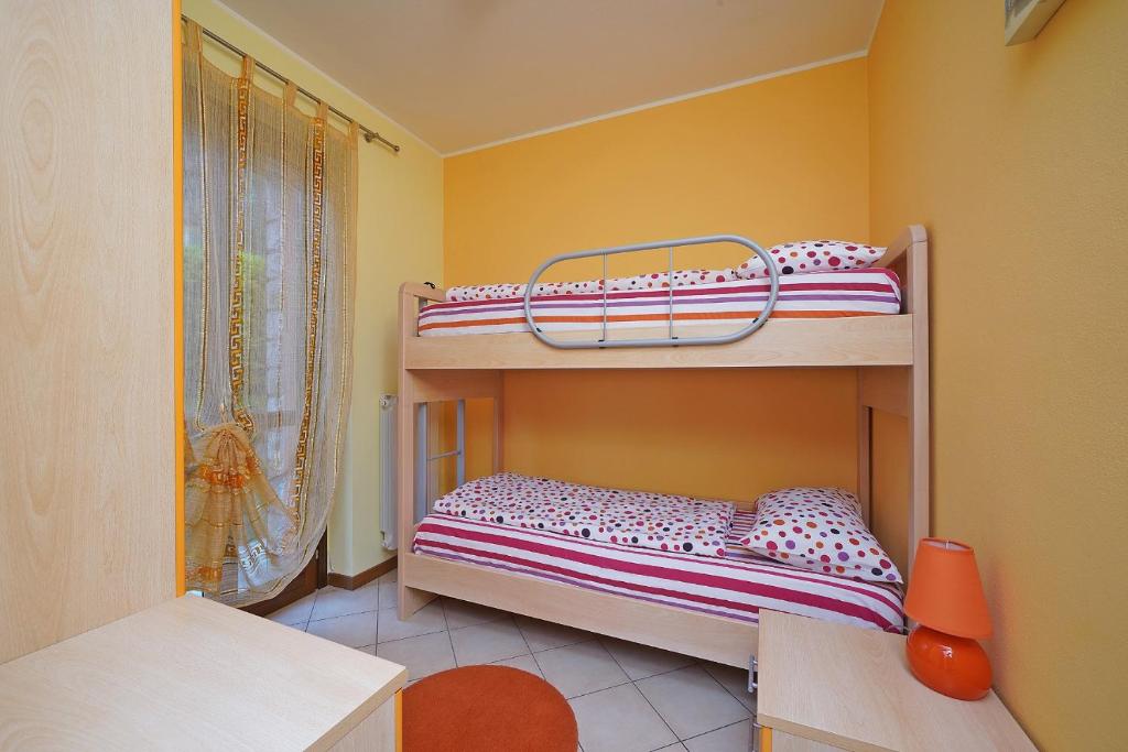 A bed or beds in a room at Messaga