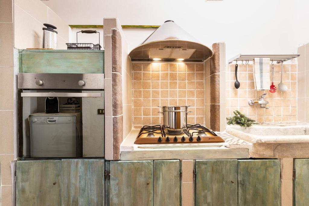 Kuchyň nebo kuchyňský kout v ubytování Agri Apartment La Terrazza La Ripadoro