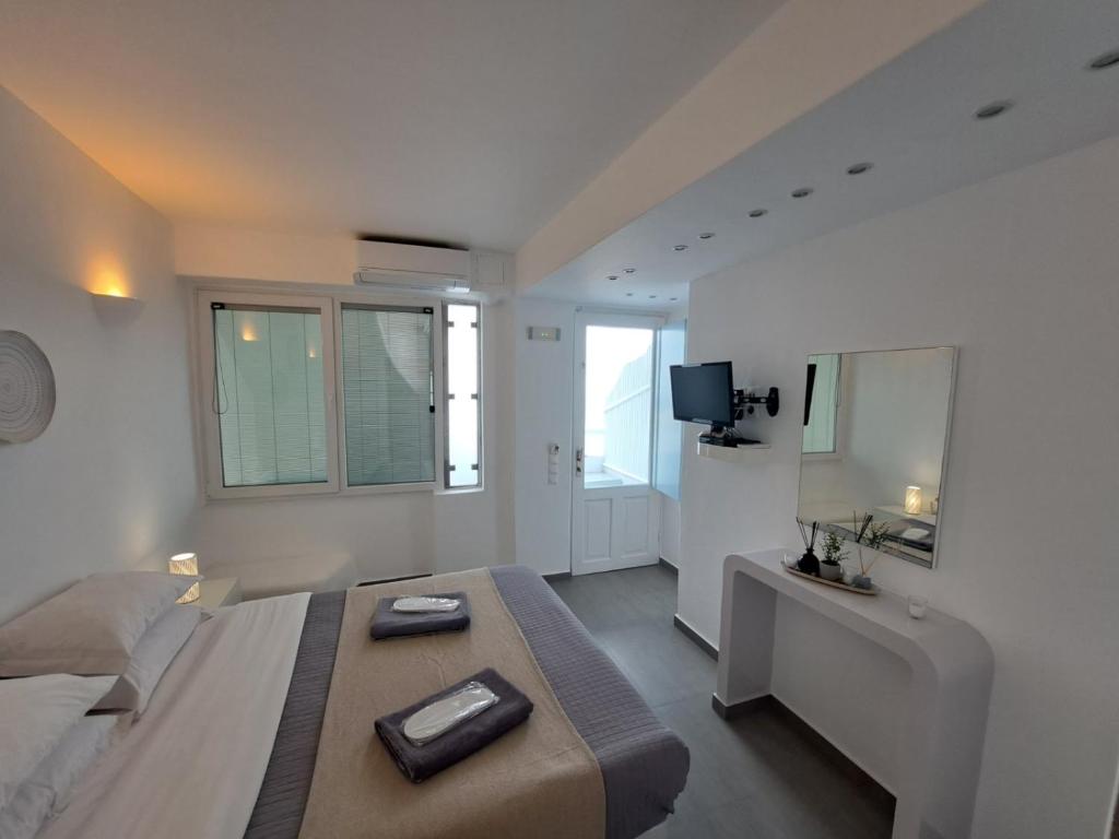 Łóżko lub łóżka w pokoju w obiekcie Dreaming View Suites