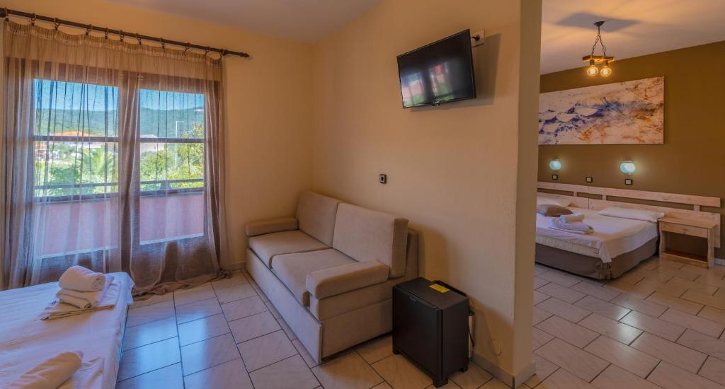 Postel nebo postele na pokoji v ubytování Natasa Hotel