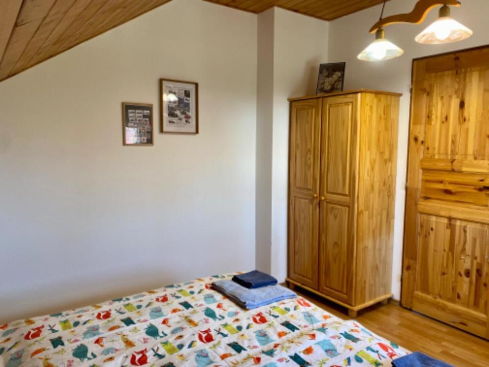 Postel nebo postele na pokoji v ubytování Apartmány u rybníčka