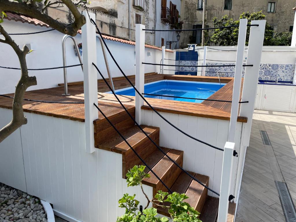 a plunge pool on the side of a house with stairs at Villa Spring Apartments in Meta