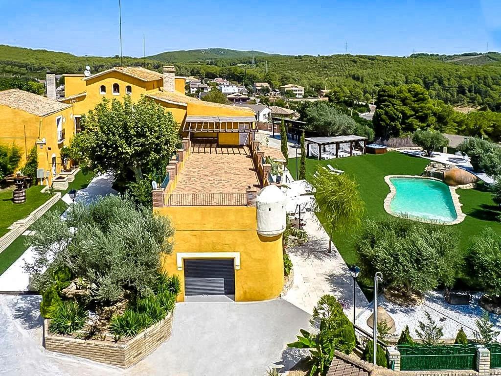 an aerial view of a house with a swimming pool at Catalunya Casas Divine and Delightful for 24 guests 12km to Sitges in Olerdola