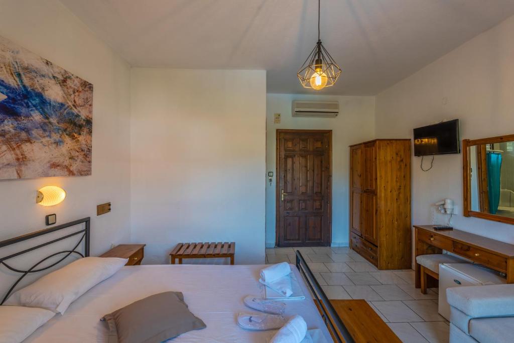 Postel nebo postele na pokoji v ubytování Natasa Hotel