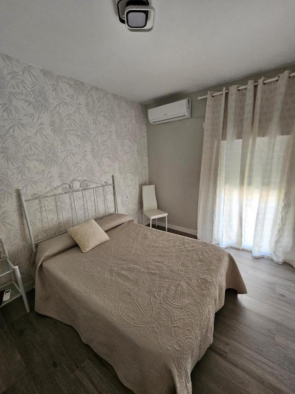 Postel nebo postele na pokoji v ubytování Casa Rural A la Vera de Monfrague