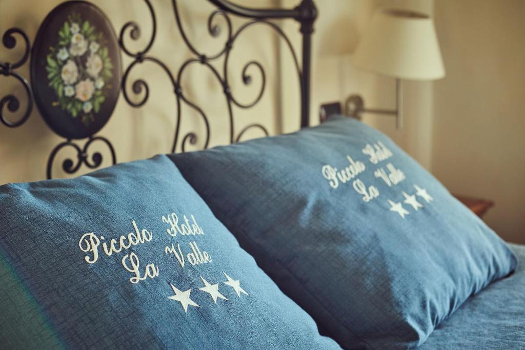 Postel nebo postele na pokoji v ubytování Piccolo Hotel La Valle