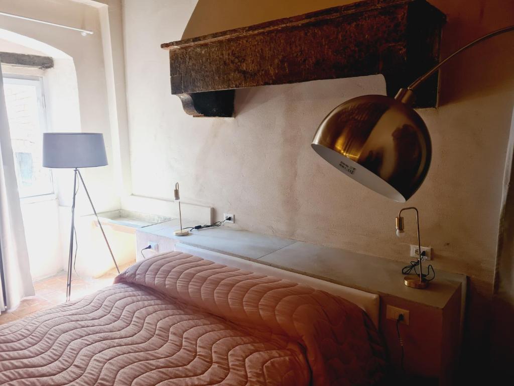 Llit o llits en una habitació de Allegra Toscana - Affittacamere Guest house Arezzo