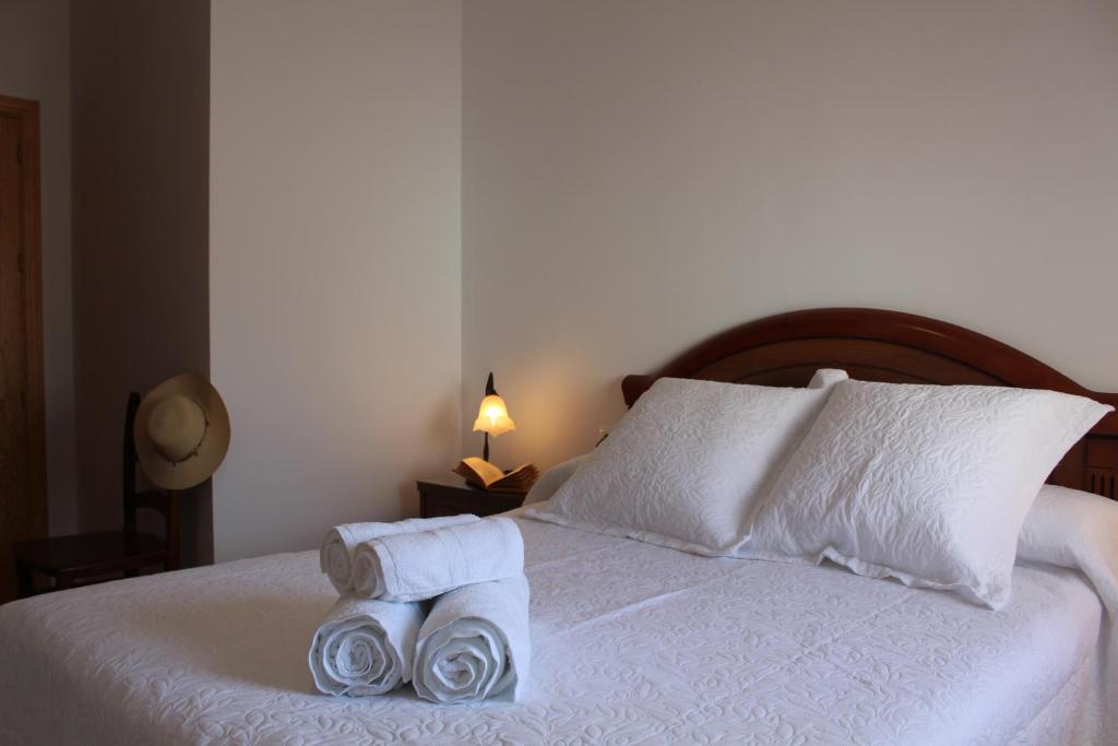 Un pat sau paturi într-o cameră la Apartamento El Pasero II