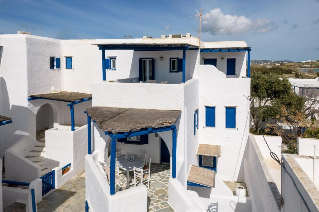 a view of a building with blue and white at Paros 3 bedrooms Messonette for 6 persons by MPS in Kampos Paros