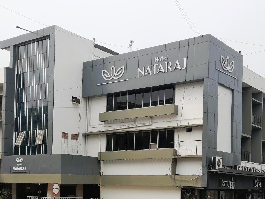 a building with a sign on the side of it at Hotel Nataraj in Jamshedpur