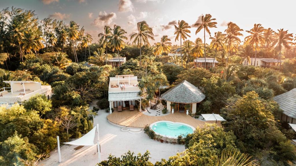an aerial view of a resort with a swimming pool at Zanzibar White Sand Luxury Villas & Spa - Relais & Chateaux in Paje