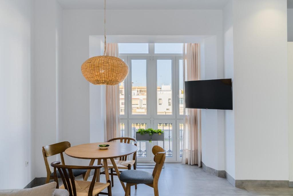 Televízia a/alebo spoločenská miestnosť v ubytovaní CASA DE LA VEGA SUITES