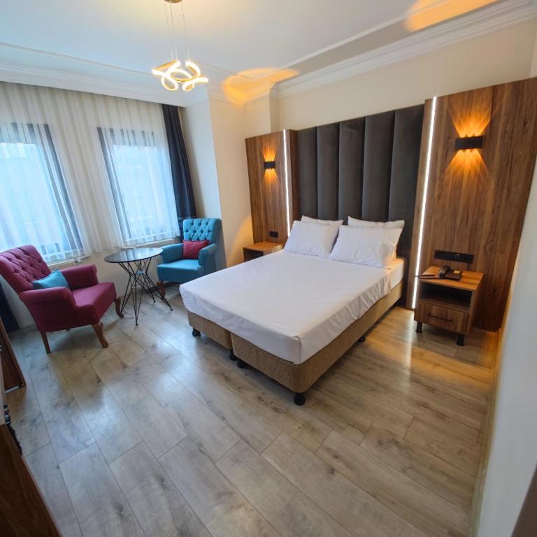 Postel nebo postele na pokoji v ubytování Star Hotel