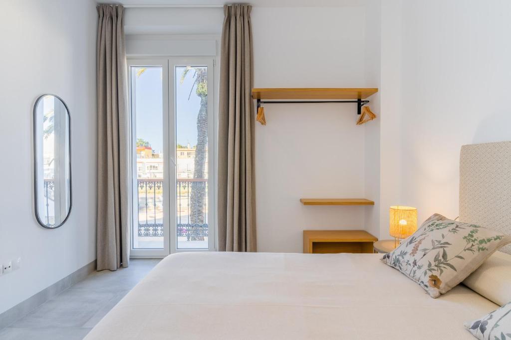 Posteľ alebo postele v izbe v ubytovaní CASA DE LA VEGA SUITES