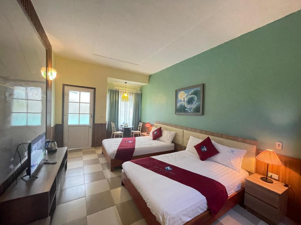Postel nebo postele na pokoji v ubytování Minh Chau Beach Resort