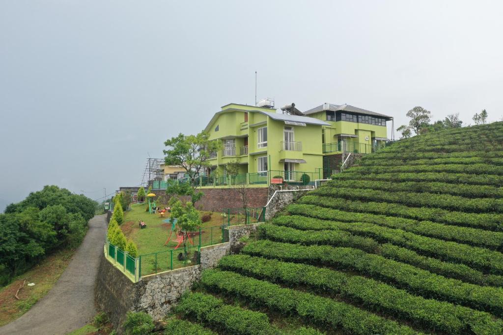 a house on top of a hill with vines at Vaga Mist Resort Vagamon in Idukki