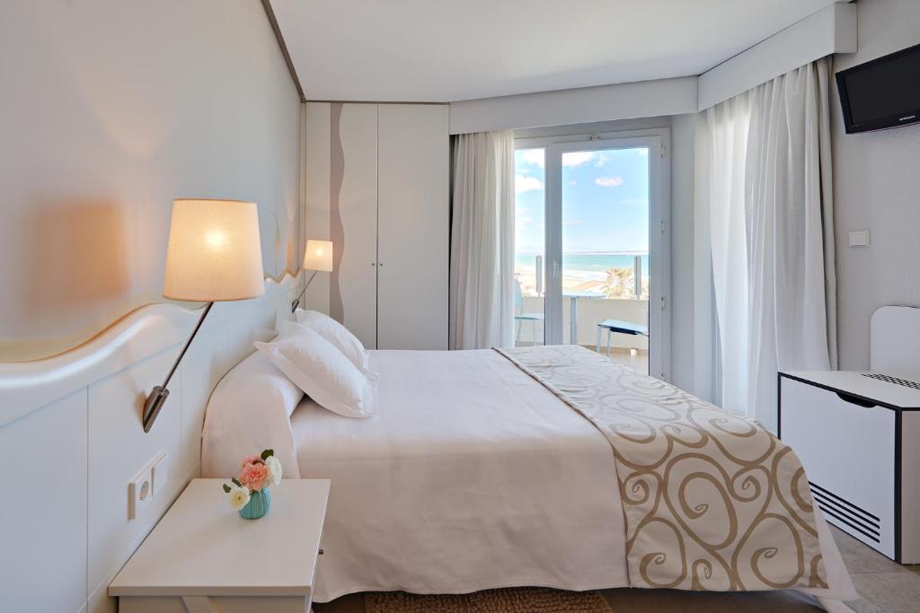 Postel nebo postele na pokoji v ubytování Hotel Meridional