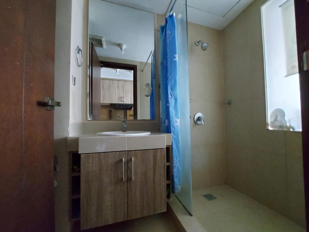 a bathroom with a sink and a shower with a mirror at Apartment U Residence Tower 2 Karawaci, Tangerang Studio FULL FURNISHED SEWA in Klapadua