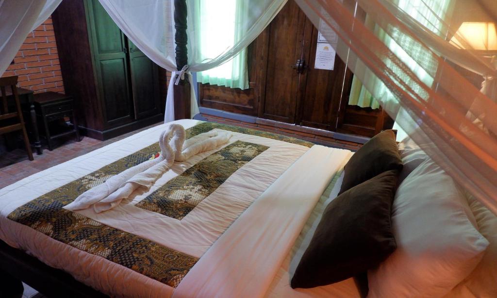 Postel nebo postele na pokoji v ubytování Danasari Homestay