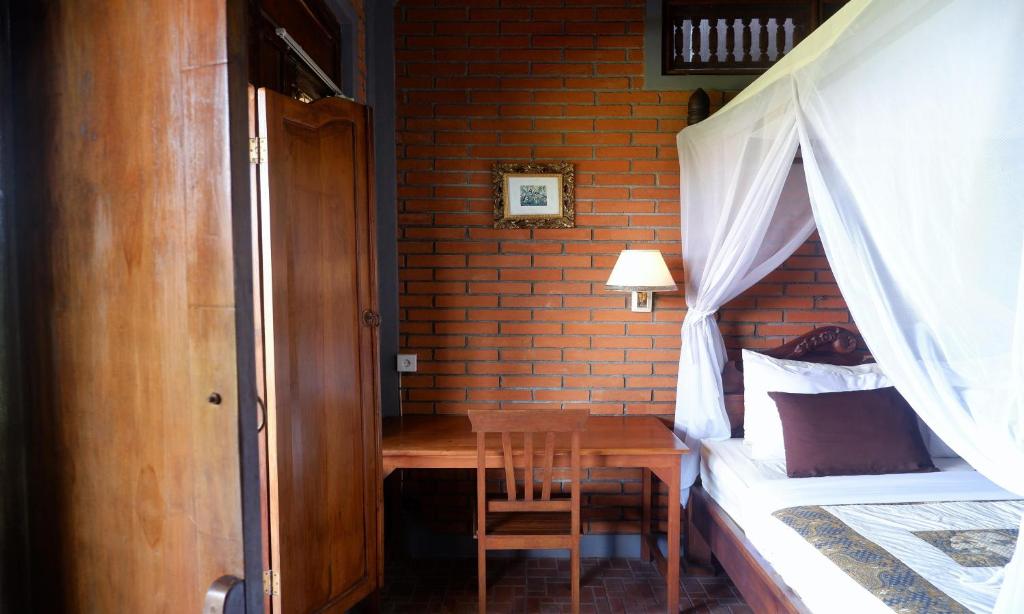 Postel nebo postele na pokoji v ubytování Danasari Homestay