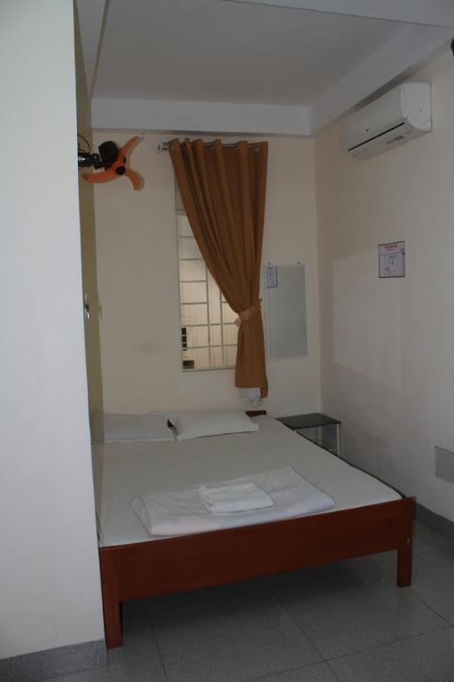 Postel nebo postele na pokoji v ubytování Ngoc Mai Guesthouse
