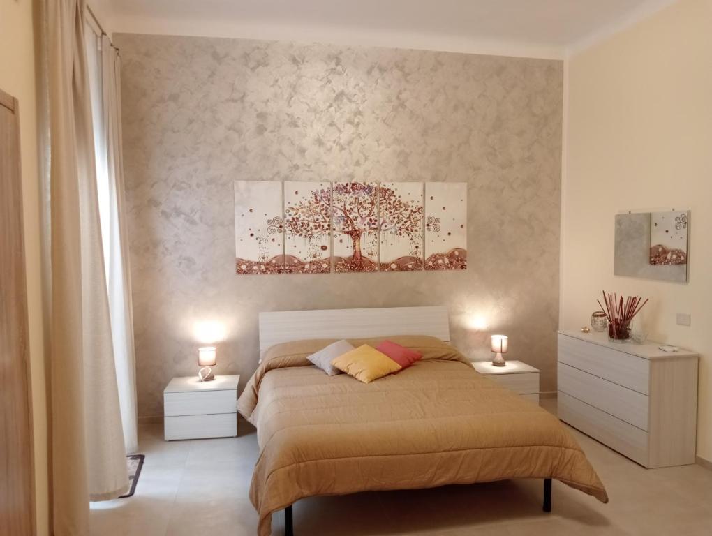 Postel nebo postele na pokoji v ubytování B&B CASA ELISABETTA
