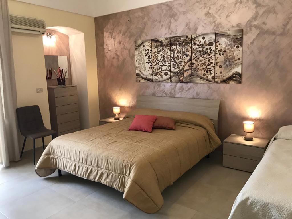 Postel nebo postele na pokoji v ubytování B&B CASA ELISABETTA