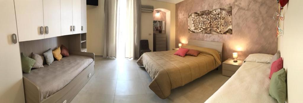 Postel nebo postele na pokoji v ubytování B&B CASA ELISABETTA