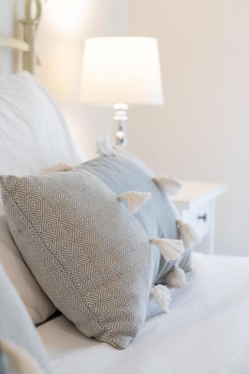 Postel nebo postele na pokoji v ubytování Amalthia Apartment Piraeus