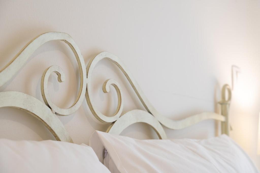 Postel nebo postele na pokoji v ubytování Amalthia Apartment Piraeus