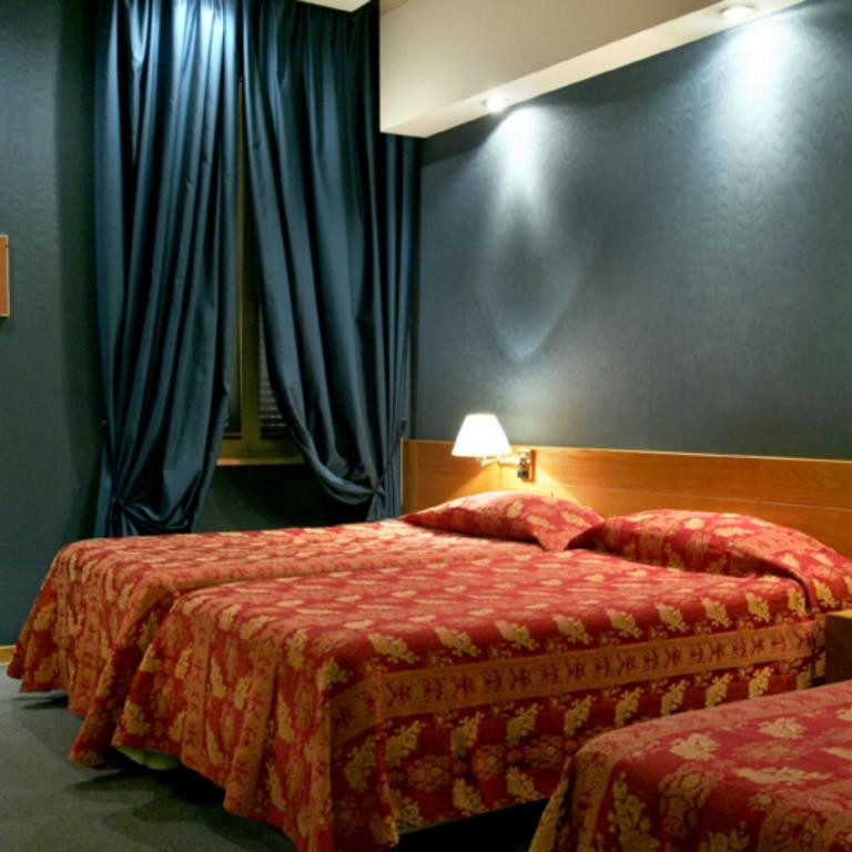 Postel nebo postele na pokoji v ubytování LH Hotel Andreotti