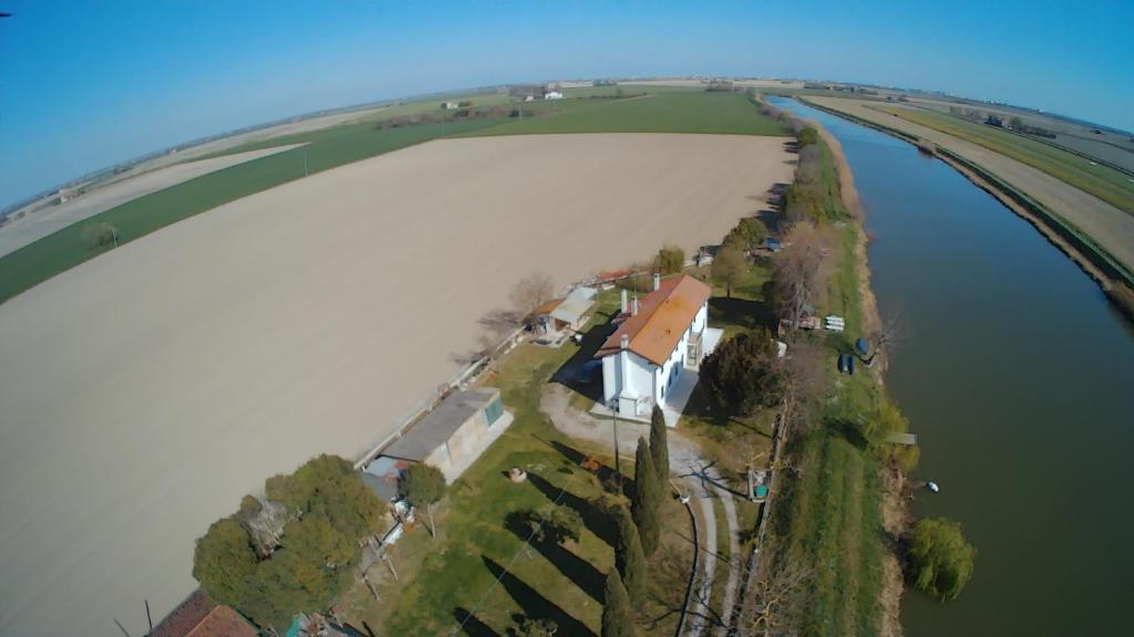 an aerial view of a house on an island in the water at Casa di campagna Cà Teresa in Caorle