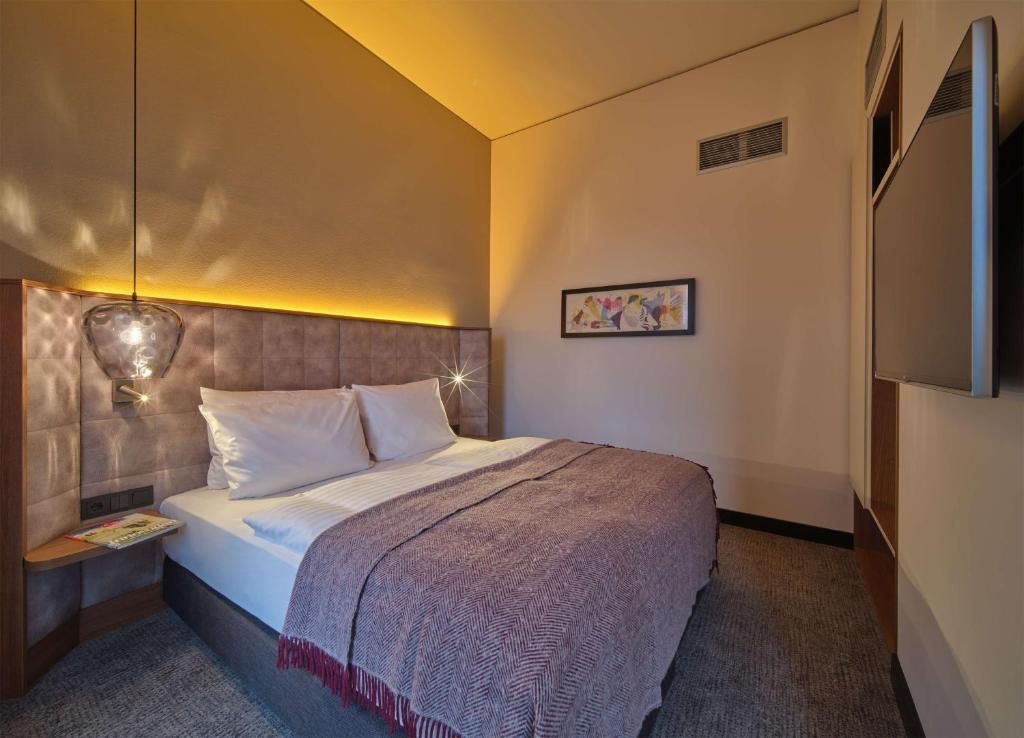 Postel nebo postele na pokoji v ubytování Adina Apartment Hotel Nuremberg