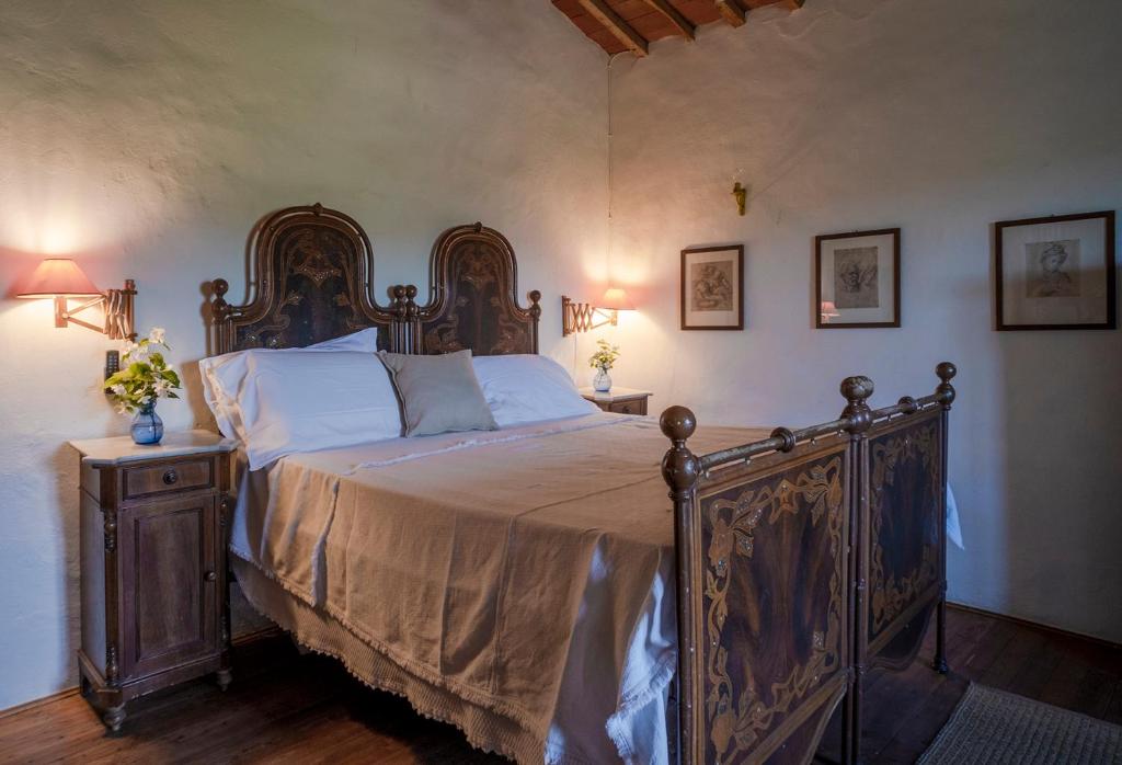 Postel nebo postele na pokoji v ubytování Castello del Calcione