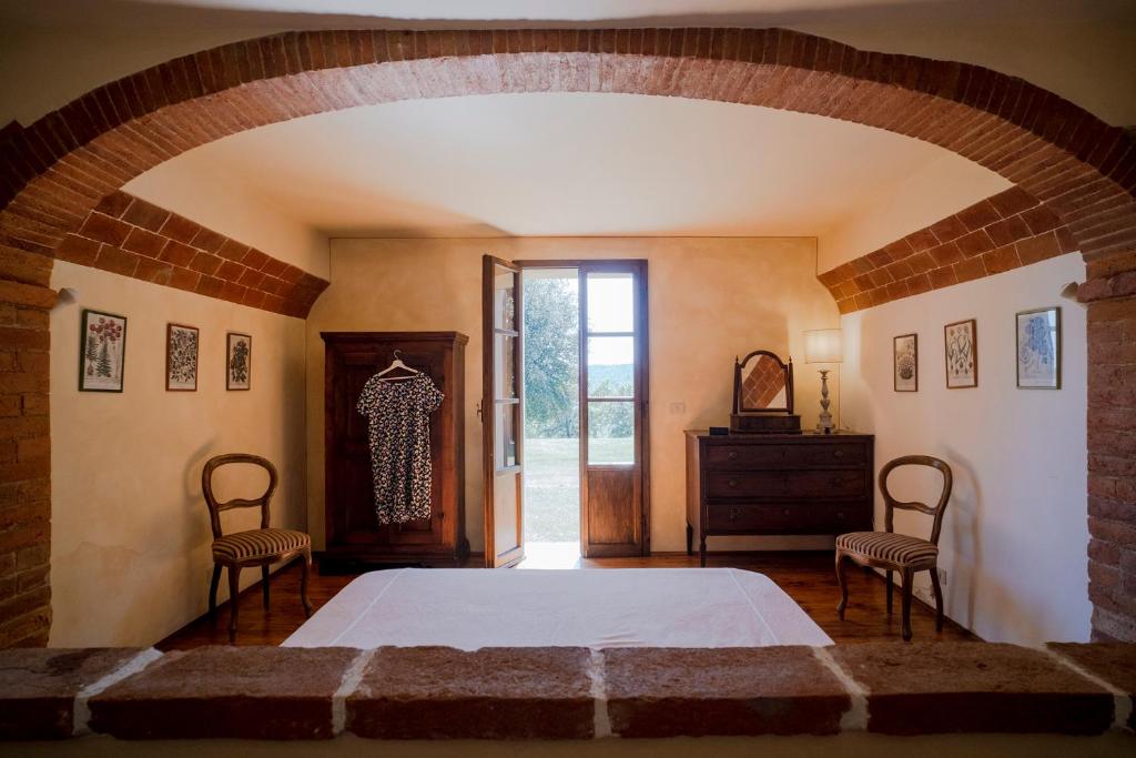 Postel nebo postele na pokoji v ubytování Castello del Calcione