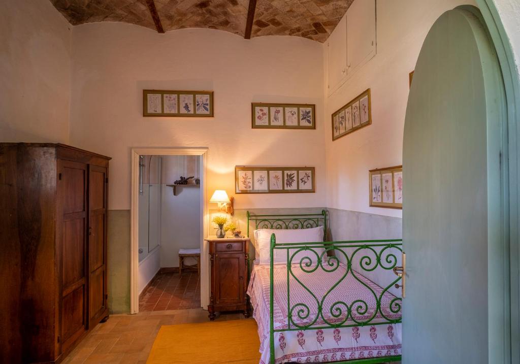 Postel nebo postele na pokoji v ubytování Castello del Calcione